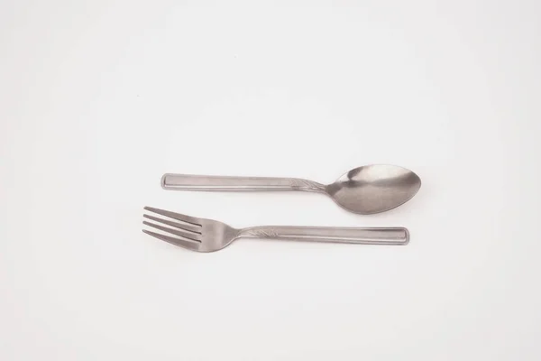 Steel silver fork and spoon isolated on white background — Stock Photo, Image