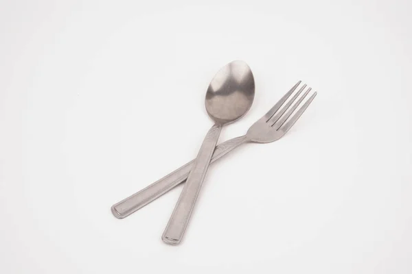 Steel silver fork and spoon isolated on white background — Stock Photo, Image