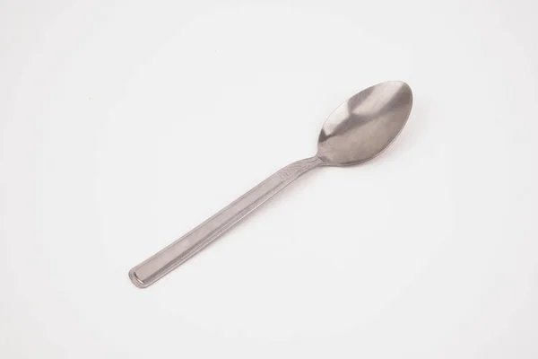 Steel silver spoon isolated on white background — Stock Photo, Image