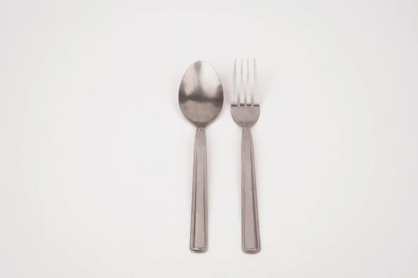 Steel silver fork and spoon isolated on white background — Stock Photo, Image