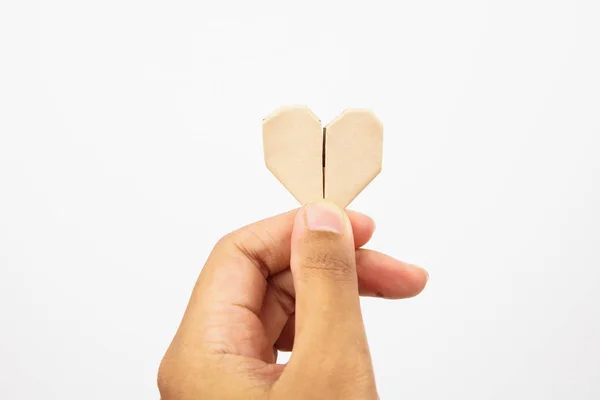 Орігамі паперове серце на руці з білим тлом — стокове фото