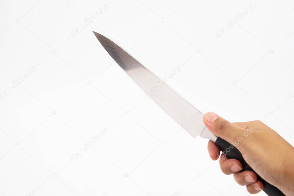 A hand holds a kitchen knife with a white background