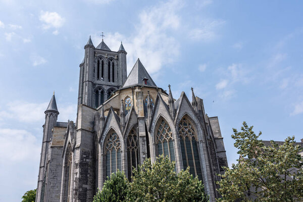 The Saint Bavo Cathedral (Sint-Baafs Cathedral) in Ghent, historical city of Belgium, on a sunny day