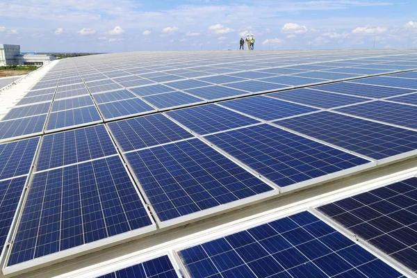 Solar PV Rooftop with Workers Walking