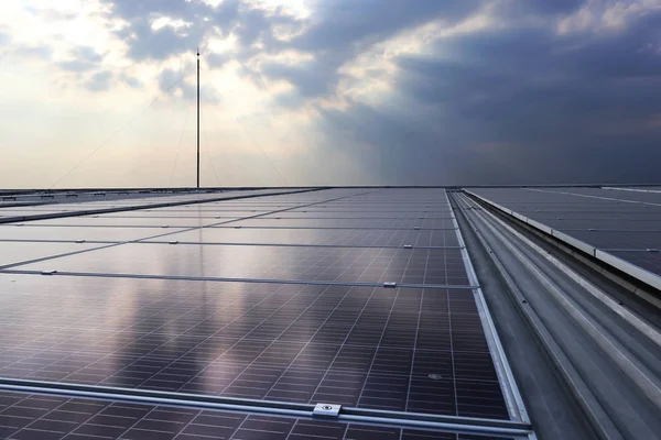 Solar PV Rooftop under Cloud with Sunlight Beam