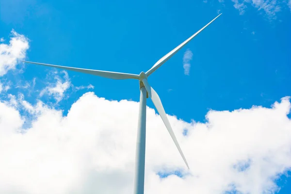 WINDMILL ELECTRICAL GENERATOR BLUE SKY CLOUD IN BACKGROUND