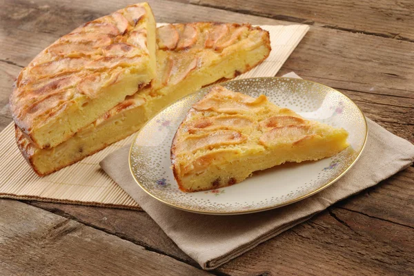 Apple pie sliced on the plate on the table