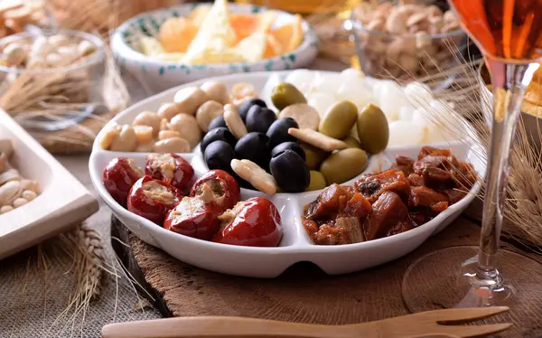 Tray and bowls with starters and snacks — Stock Photo, Image