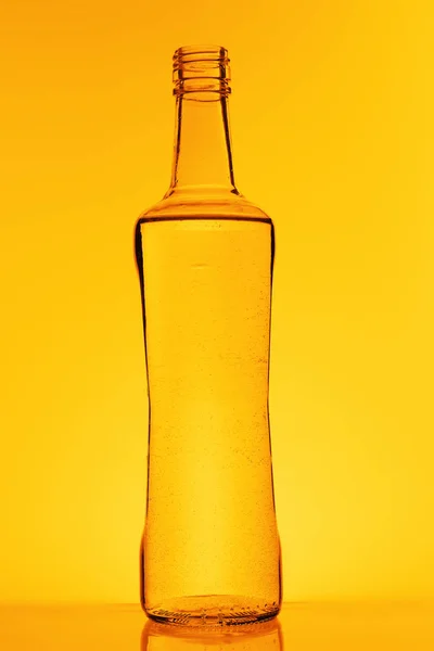 Botella Vodka Sobre Fondo Amarillo —  Fotos de Stock