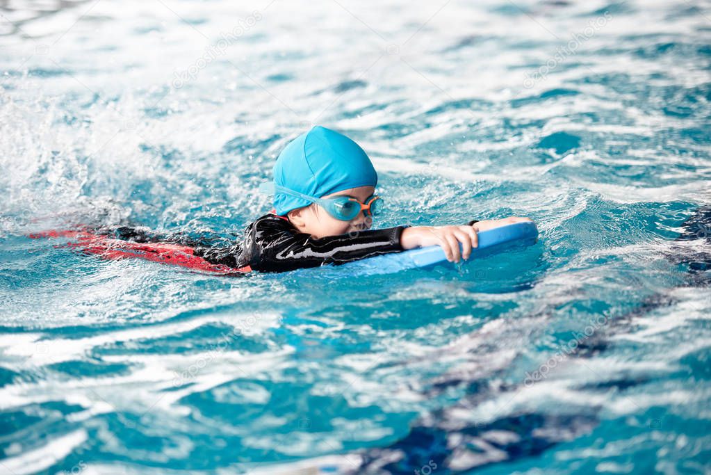 One girl wearing practice swimming.