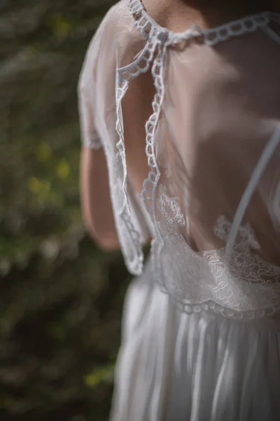 Details of the gentle image of the bride. Lace on the dress, rin