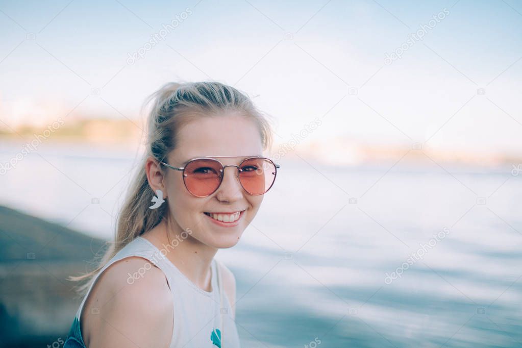 ortrait of a young woman by the lake, sea.