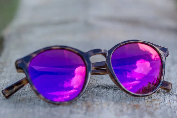 Sunglasses Lie Old Wooden Table Reflect Sky Clouds — Stock Photo, Image