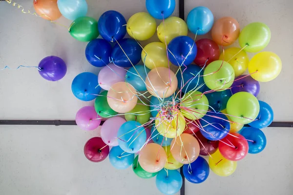 Beam of bright, beautiful balloons on the ceiling in the room.
