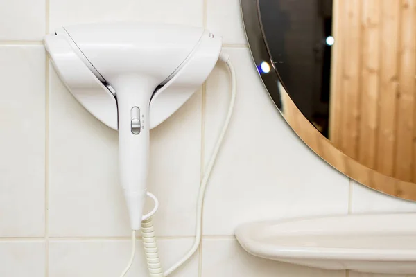 Small White Hairdryer Attached Wall Next Mirror Hotels Bathroom Free — Stock Photo, Image