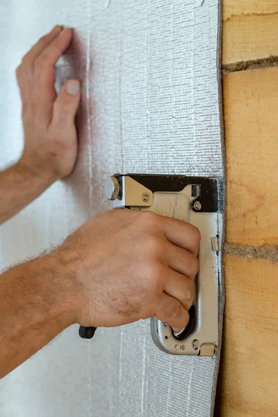 Man Hand Help Construction Stapler Attached Wooden Beam Foil Insulation Stock Photo