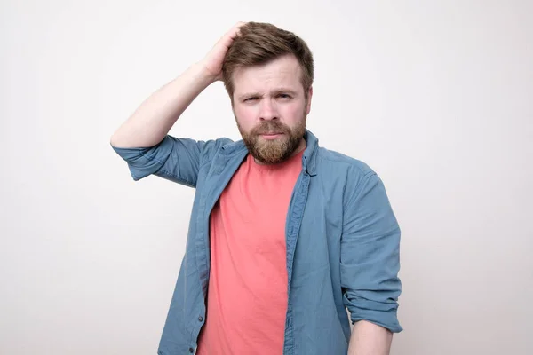 Thoughtful Concerned Bearded Man Narrowed His Eyes Looks Camera Isolated — Stock Photo, Image