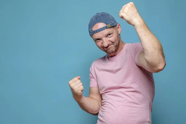 Yes I did it. Confident Caucasian man is pleased with his success and showing clenched fist gesture. Copy space. — Stock Photo, Image