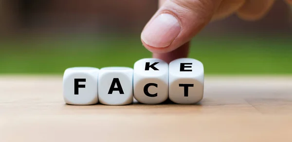 Hand Turning Dice Changes Word Fake Fact — Stock Photo, Image