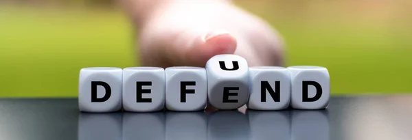 Hand Turns Dice Changes Word Defend Defund — Stock Photo, Image