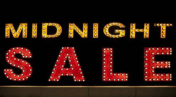 Midnight sale background. Brightly colored vintage advertising sign board with illumination — Stock Photo, Image