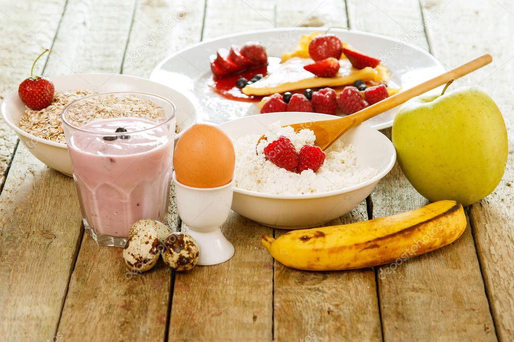 Healthy breakfast cconcept. Different food on the wooden table.