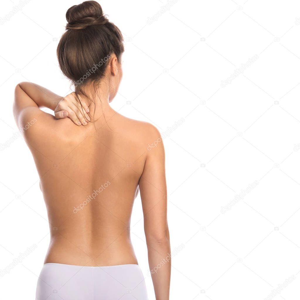 Woman with pain in back and neck on white background