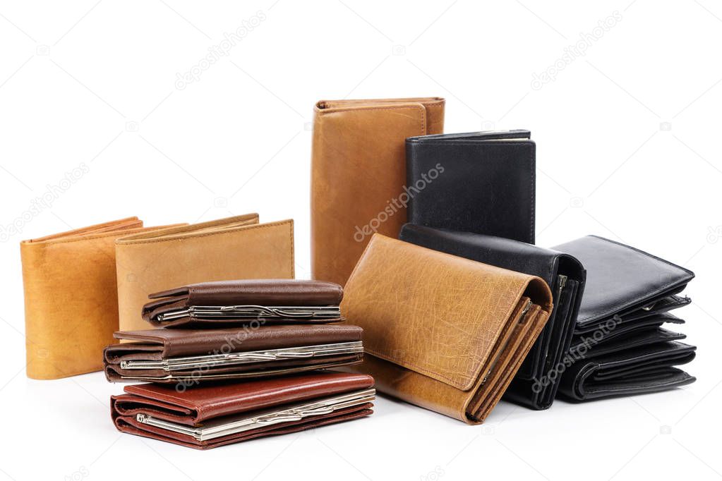Close up view of different leather wallets isolated on white background