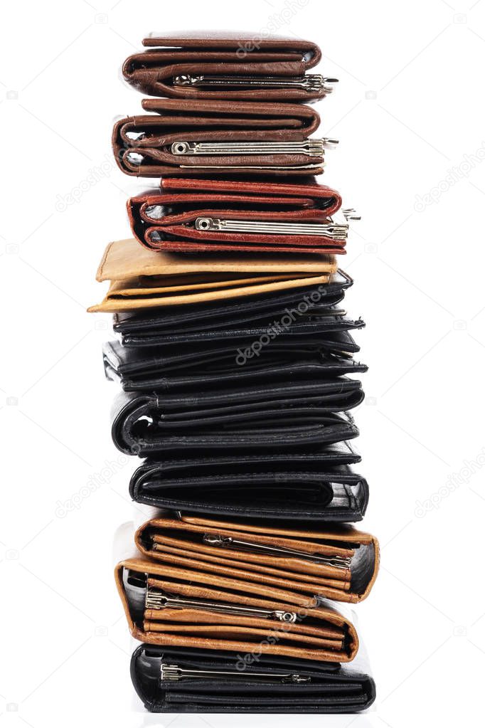 Close up view of different leather wallets isolated on white background