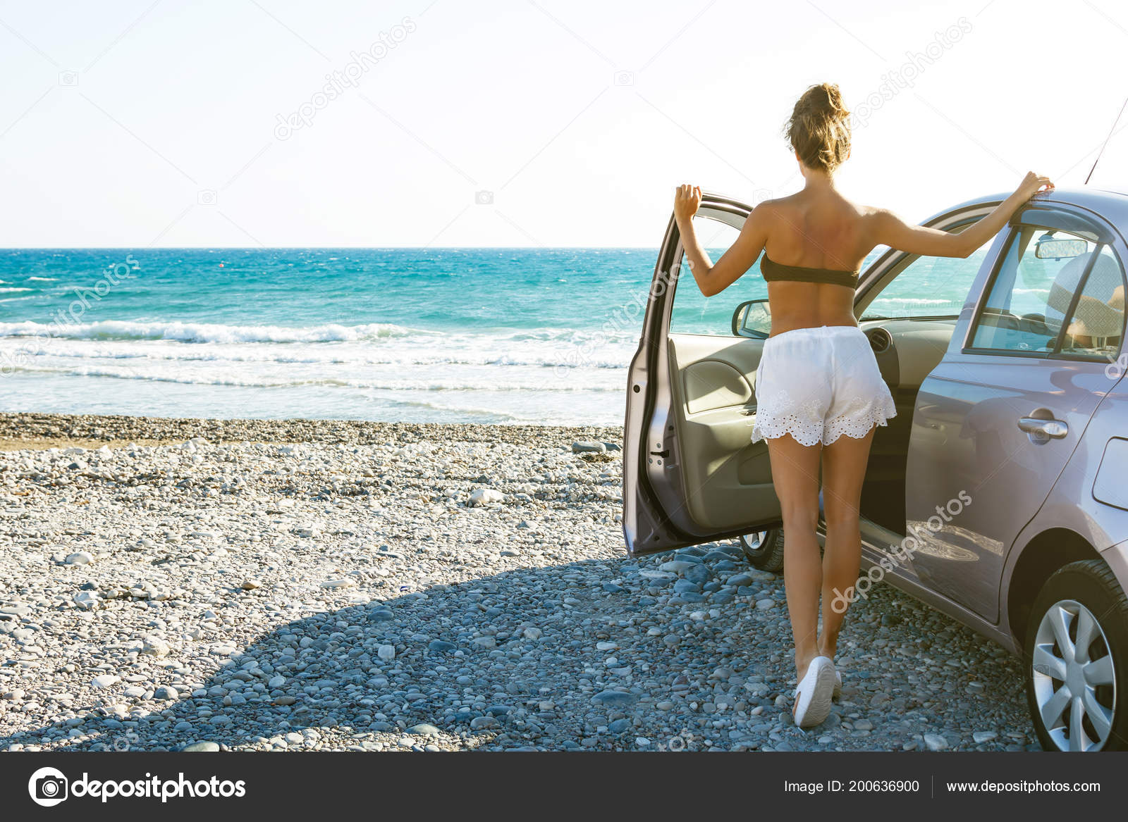 Sexy girl pushing car