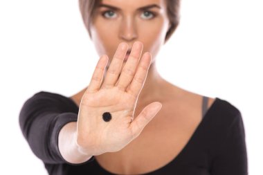 Woman with black dot on her palm give signal about domestic violence clipart