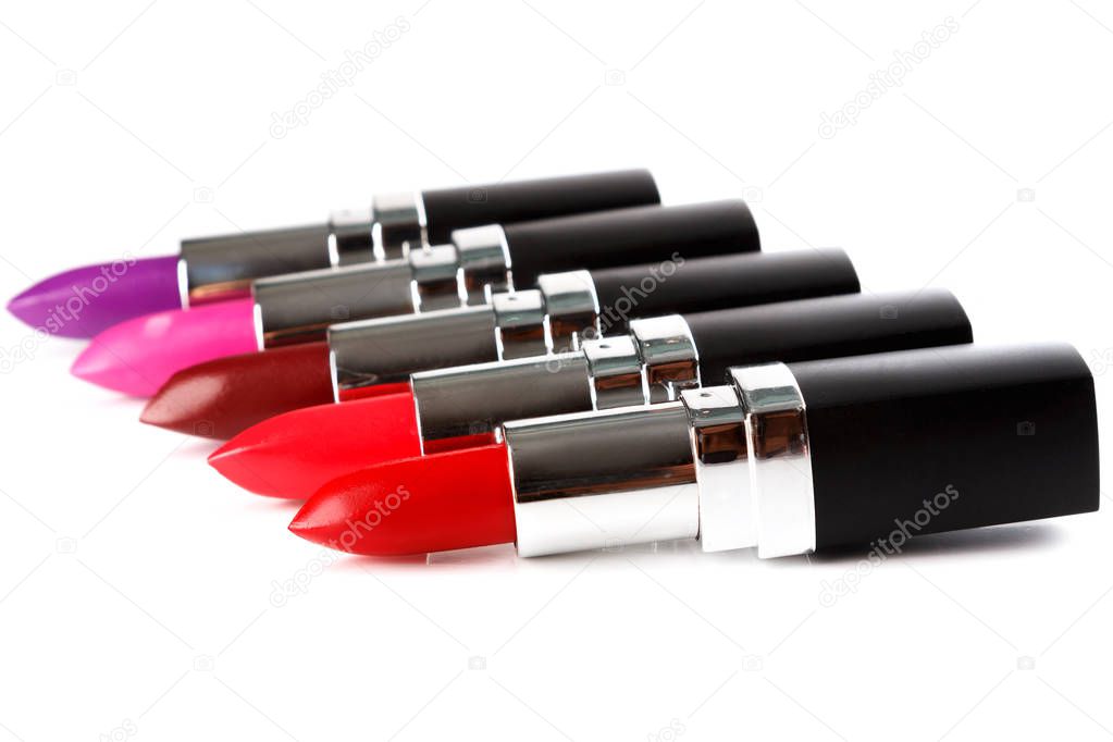 Different lipsticks isolated on white background