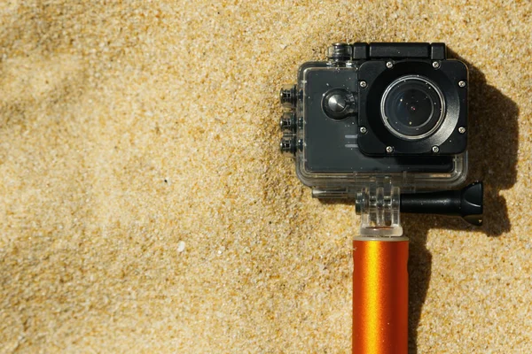 Action camera in waterproof case on the beach