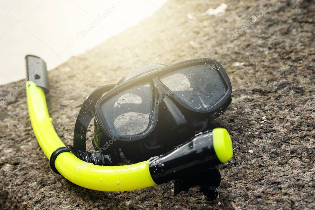 Close up view of mask for snorkeling on sandy beach