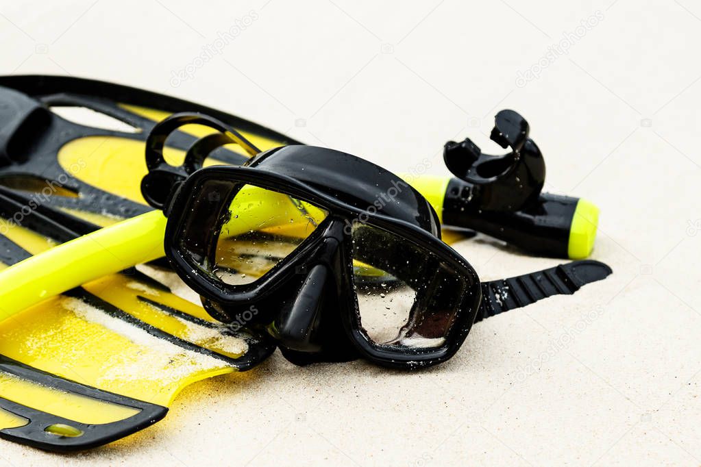 Equipment for snorkeling on sandy beach, close up 