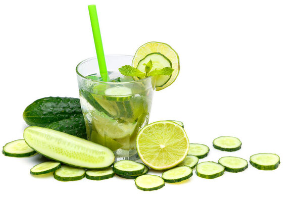 Refreshing drink with cucumbers, limes and mint on white background