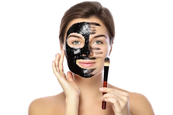 Beautiful Woman Applying Purifying Black Mask Her Face White Background — Stock Photo, Image