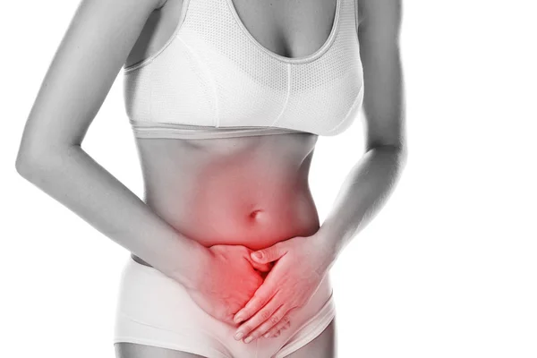 Woman is feeling pain in lower part of her stomach on white background — Stock Image Woman Feeling Pain Lower Part Her Stomach White Background Royalty Free Stock Images