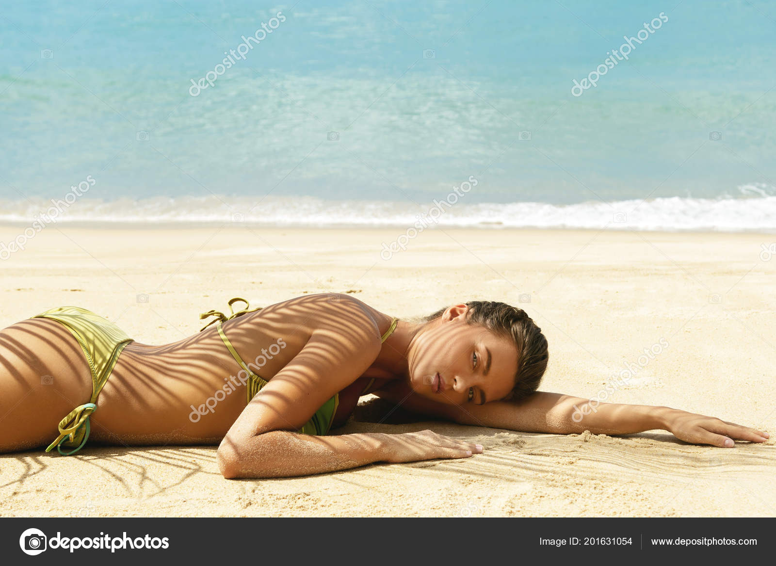 Woman lying on beach