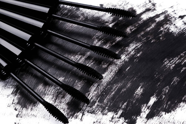 Close up view of brushes and smudged mascara