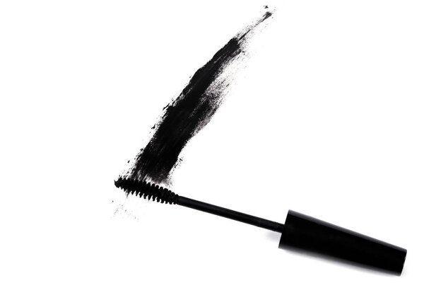 Smudged mascara on white background