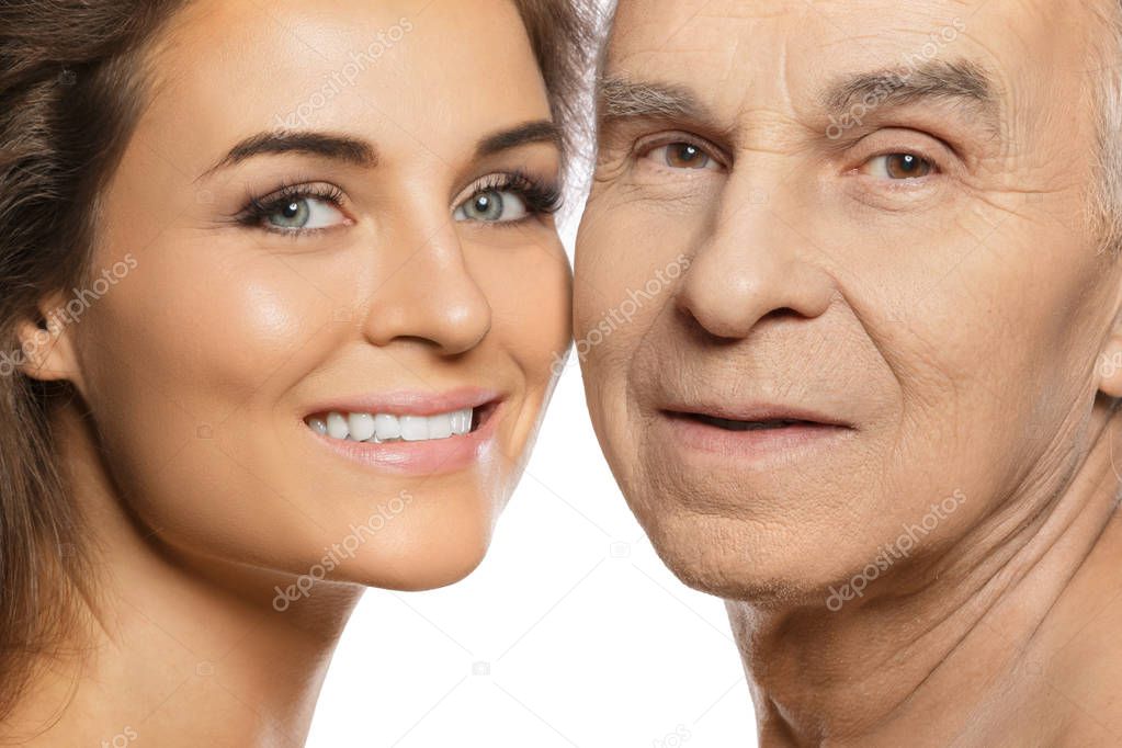 Happy elderly father and his beautiful daughter on white background