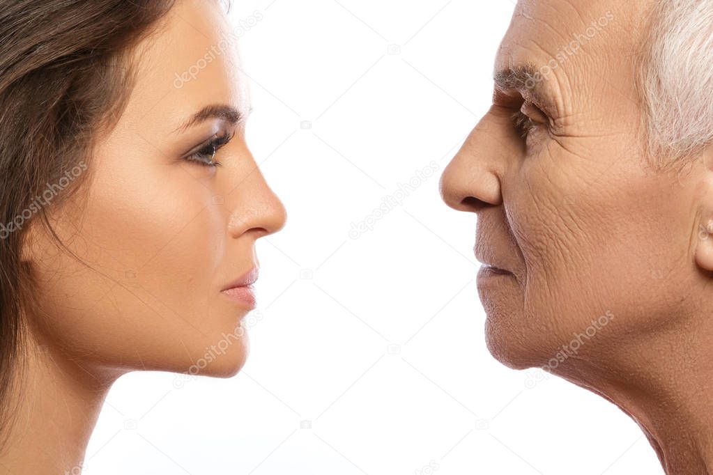 Elderly father and his beautiful daughter on white background