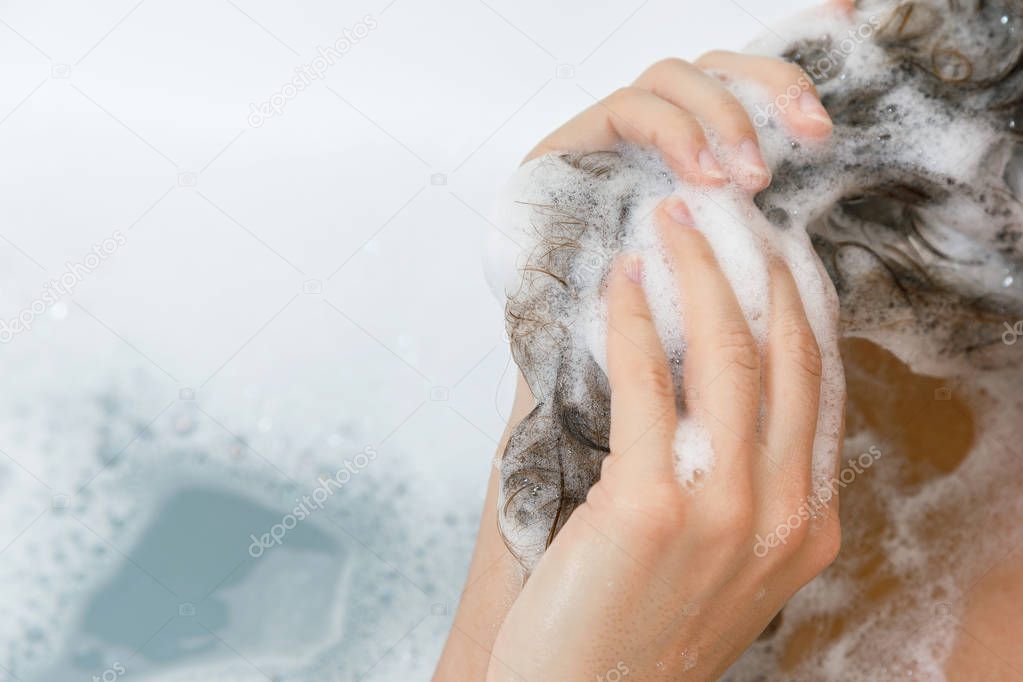 Close-up view of female hair in shampoo