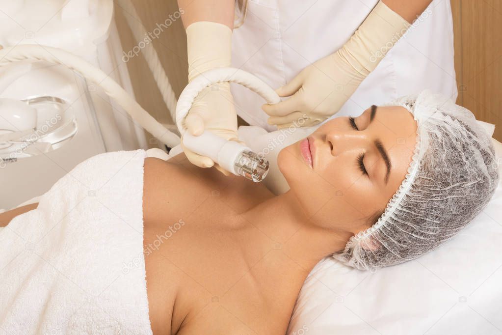 Woman in professional beauty salon during contour plastic procedure