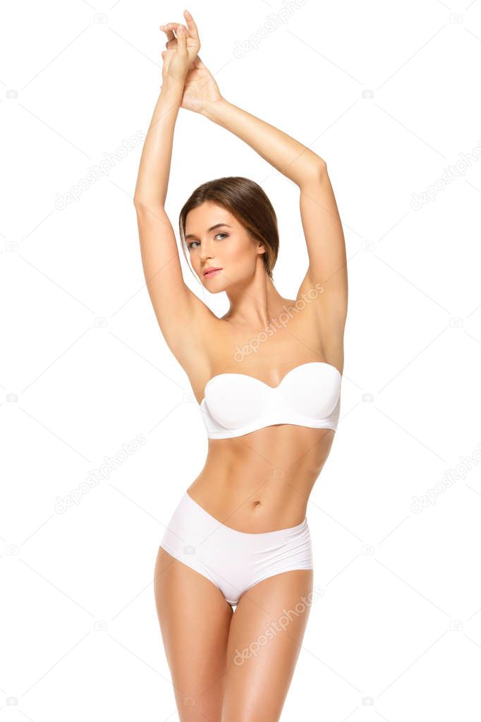 Young woman with beautiful body isolated on white background