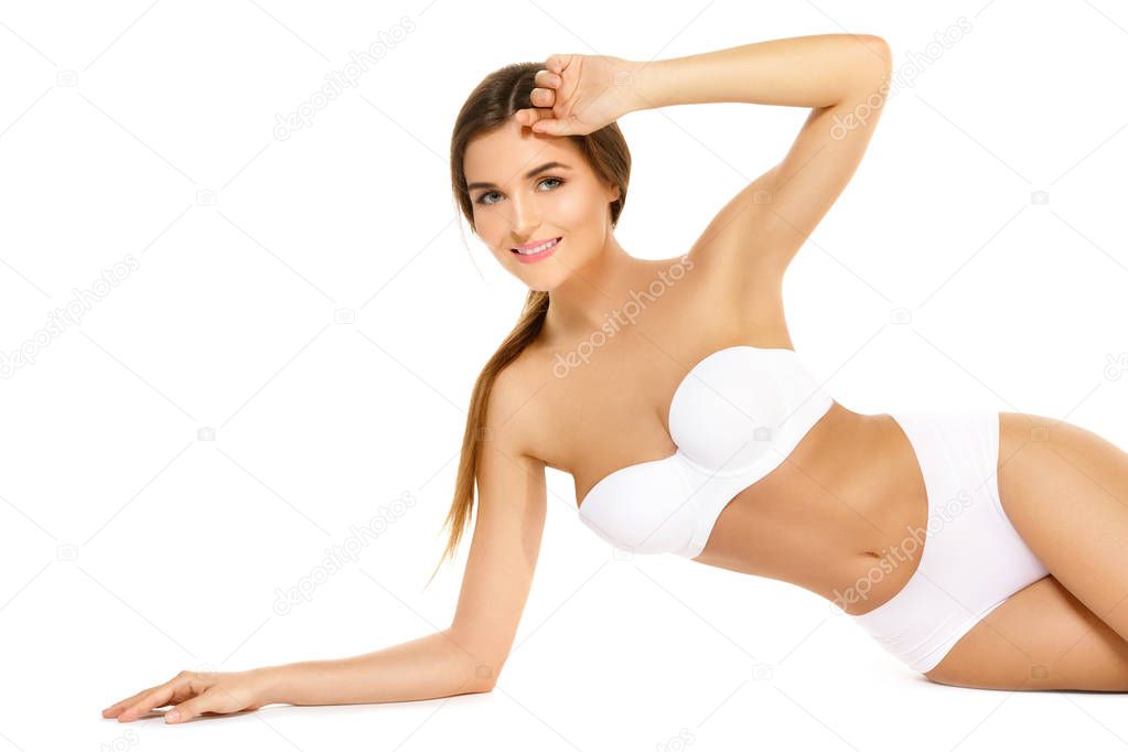 Happy woman with a beautiful body isolated on white background