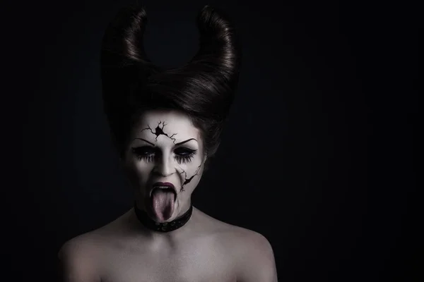 stock image Model in creative image for Halloween. Spooky porcelain doll with horns on her head.