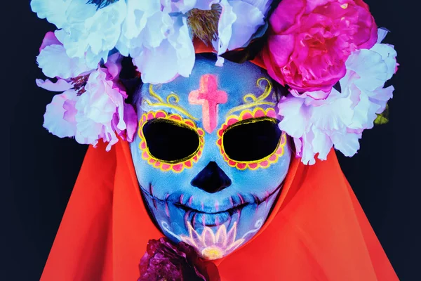 Creative image of Sugar Skull. Neon makeup for Halloween or Dia De Mertos holiday.
