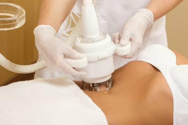 Woman during belly massage or figure correction procedure
